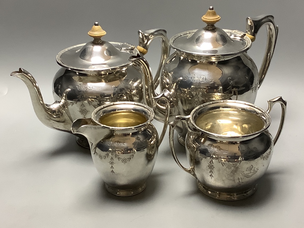 An Edwardian engraved silver four piece tea and coffee service